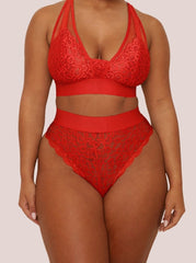 Red lace lingerie set on a plain background