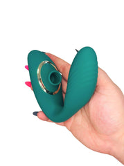 Teal silicone personal massager adult toy held in a hand with a white background